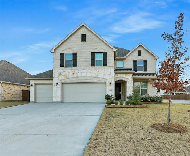 front facade featuring a garage and a front yard