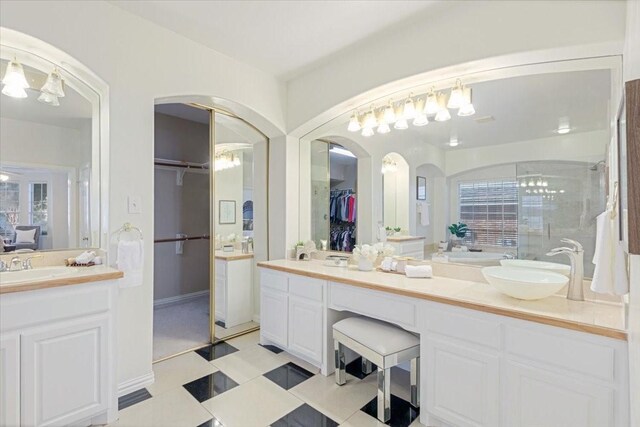 bathroom featuring tile patterned flooring and vanity