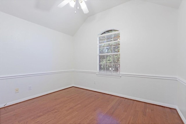 empty room featuring hardwood / wood-style floors, ceiling fan, and lofted ceiling