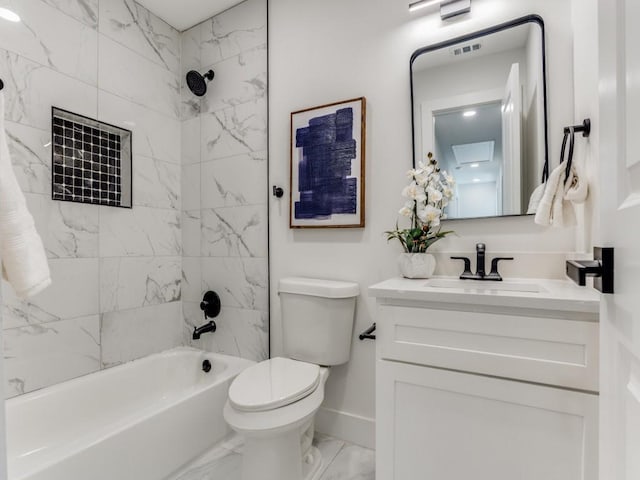 full bathroom with vanity, toilet, and tiled shower / bath