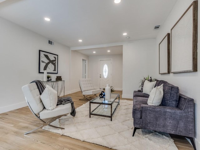 living room with light hardwood / wood-style floors