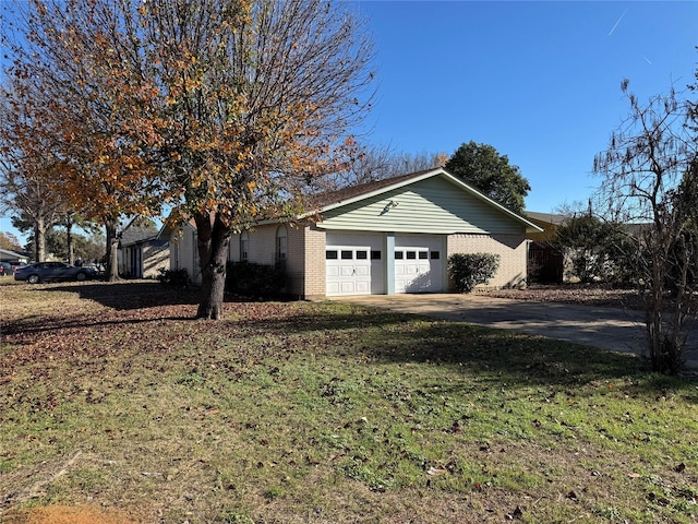 exterior space with a garage and a front yard