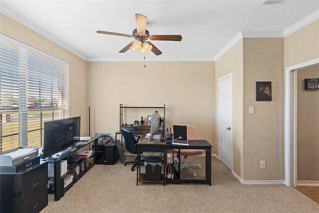 office space featuring light carpet, ceiling fan, and crown molding