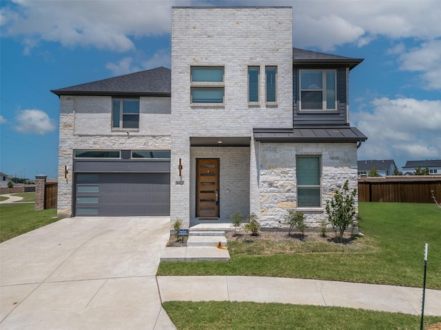 contemporary home with a garage and a front lawn