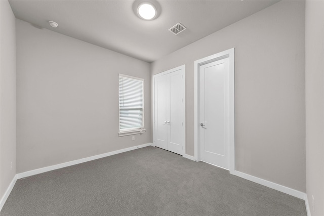 unfurnished bedroom with carpet floors