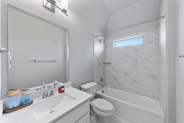 full bathroom with vanity, tiled shower / bath combo, and toilet