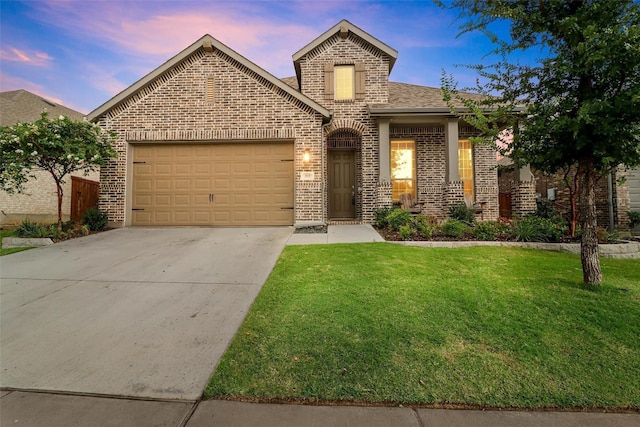 front facade with a yard and a garage