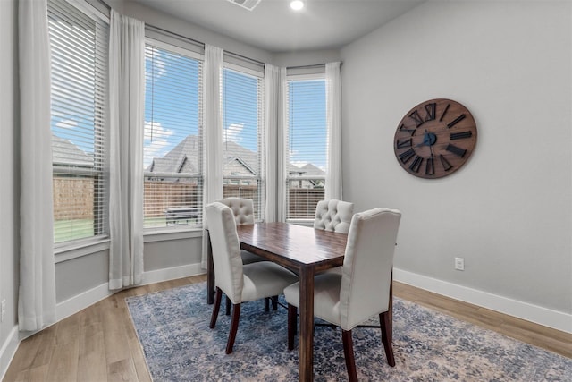 dining area with light hardwood / wood-style flooring