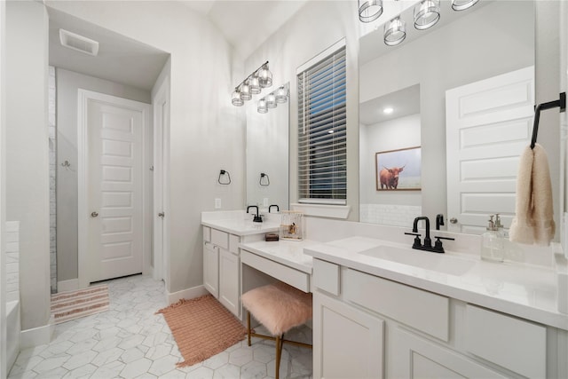 bathroom with vanity and tile patterned floors