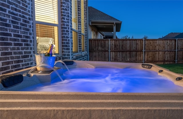 exterior space featuring a jacuzzi