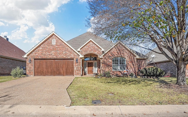 view of front facade featuring a garage and a front lawn