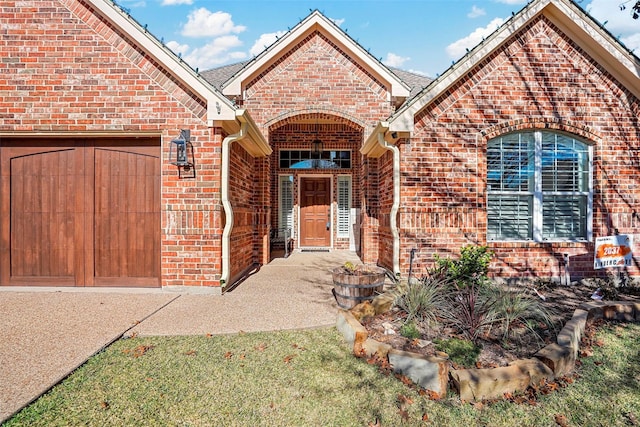 entrance to property featuring a garage