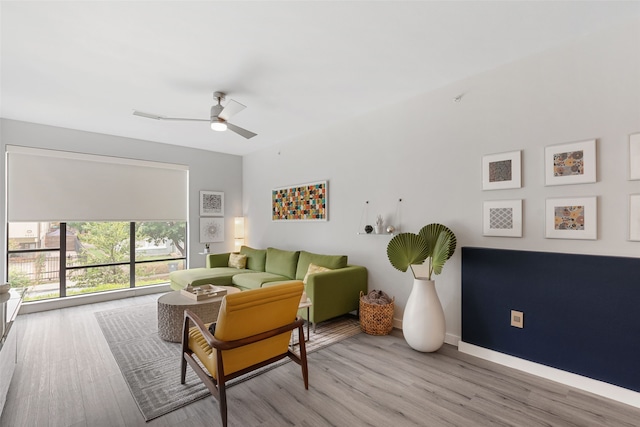 interior space with ceiling fan and light wood-type flooring