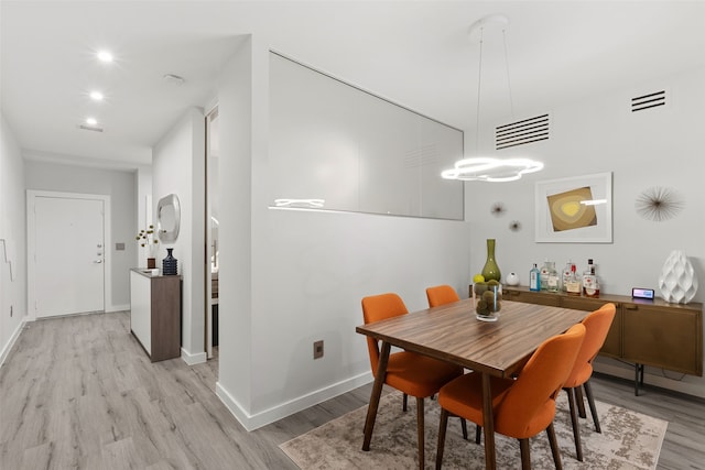 dining space featuring light hardwood / wood-style floors