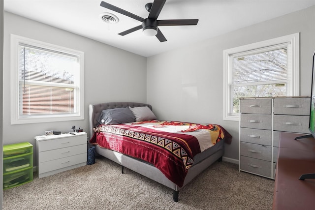 carpeted bedroom featuring ceiling fan