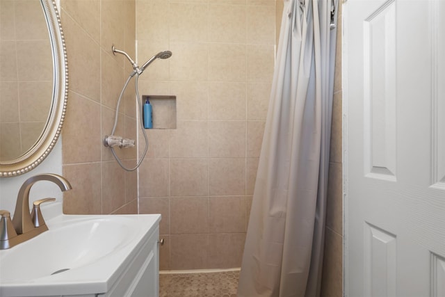 bathroom with vanity and walk in shower