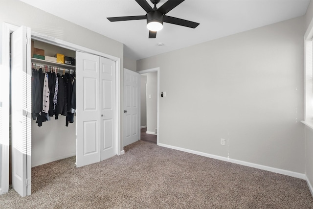 unfurnished bedroom featuring carpet flooring, multiple windows, a closet, and ceiling fan