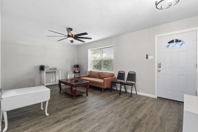 living room with ceiling fan and dark hardwood / wood-style floors