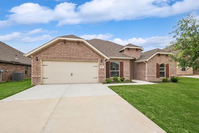 view of front of home with central AC, a front lawn, and a garage