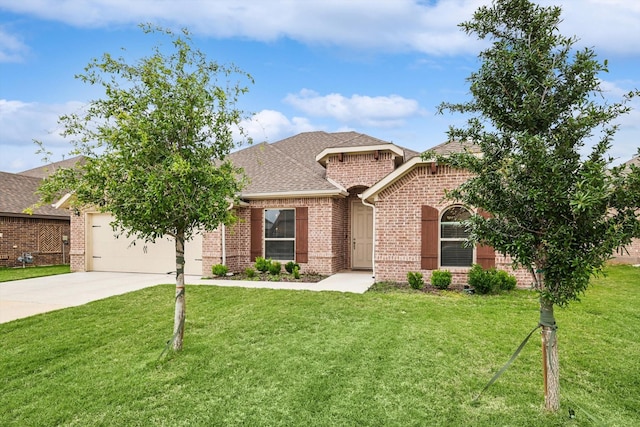 view of front facade with a garage and a front lawn