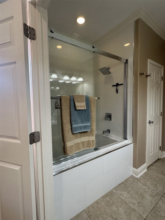 bathroom with recessed lighting, combined bath / shower with glass door, tile patterned flooring, and baseboards