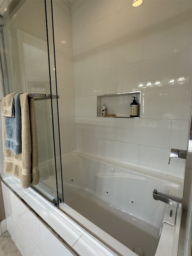 bathroom featuring a shower with shower door and a whirlpool tub