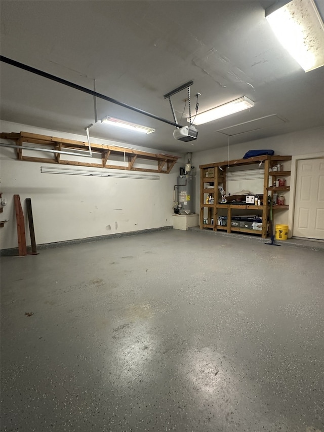 garage featuring a garage door opener and water heater