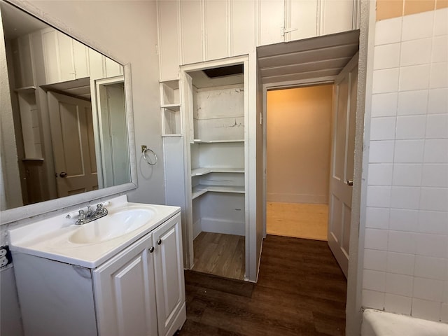 bathroom with vanity and hardwood / wood-style floors