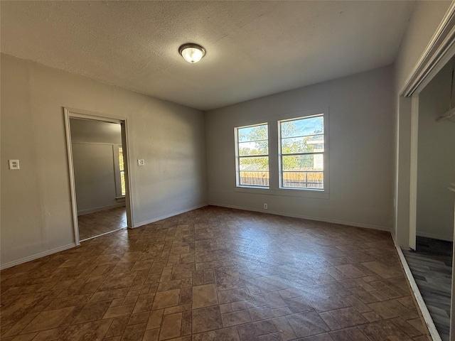 unfurnished bedroom featuring a closet and a textured ceiling