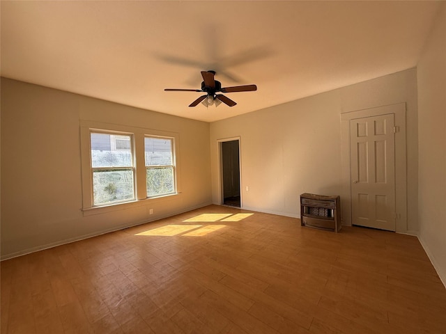 spare room with ceiling fan and light hardwood / wood-style floors