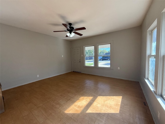 unfurnished room with ceiling fan