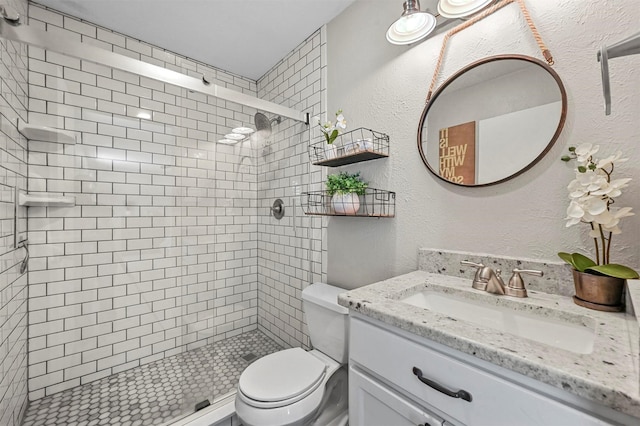 bathroom featuring vanity, toilet, and walk in shower