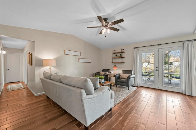 living room with ceiling fan, french doors, and lofted ceiling