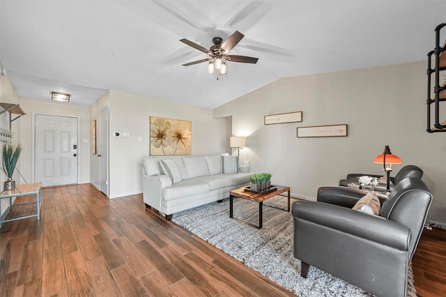 living room featuring ceiling fan and dark wood-type flooring