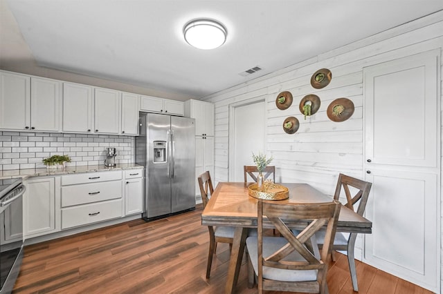 dining room with dark wood-type flooring