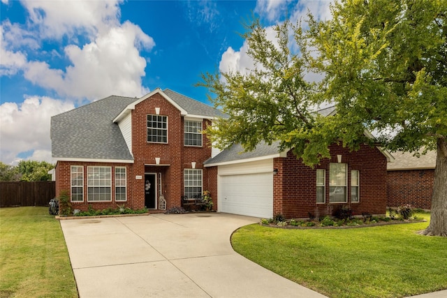 view of front of house featuring a garage and a front lawn