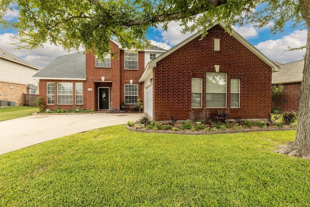 view of front of house featuring a garage, central AC, and a front lawn