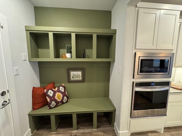 mudroom with hardwood / wood-style floors