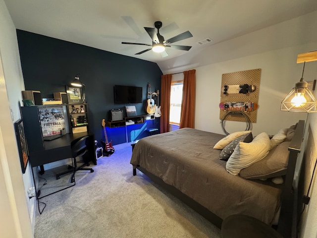 carpeted bedroom featuring ceiling fan and vaulted ceiling