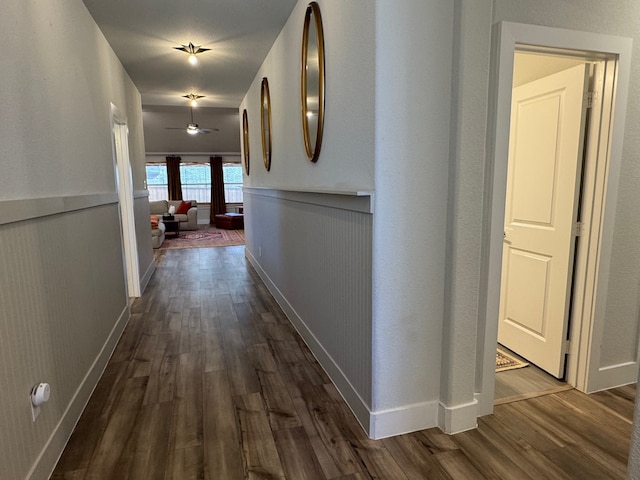 corridor featuring dark hardwood / wood-style floors