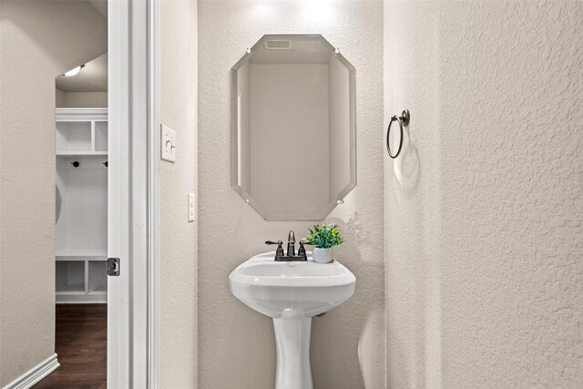 bathroom with wood-type flooring