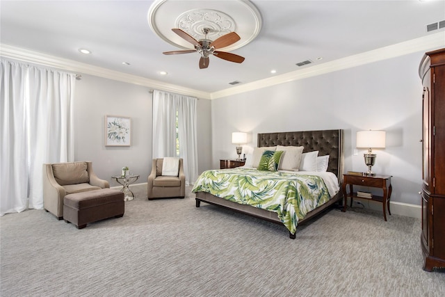 carpeted bedroom featuring ceiling fan and crown molding