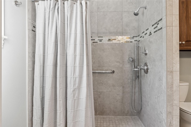 bathroom featuring toilet and walk in shower