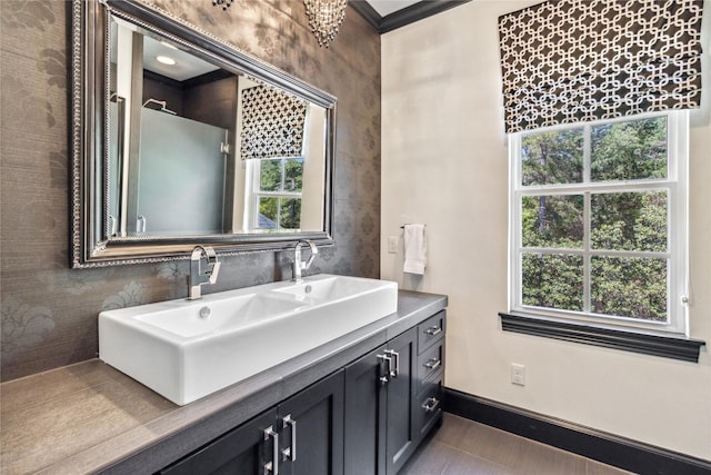 bathroom featuring vanity and crown molding