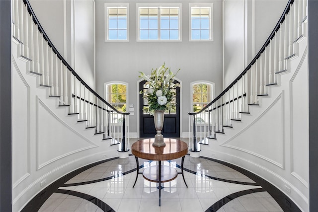 entryway with a towering ceiling