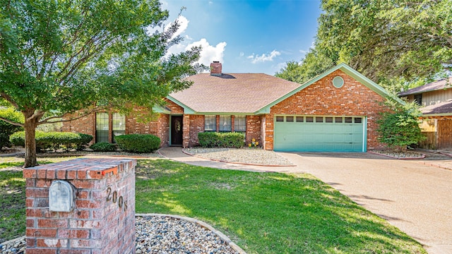 view of front of property featuring a garage and a front lawn