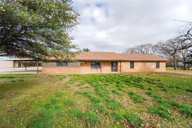 single story home with a carport and a front yard