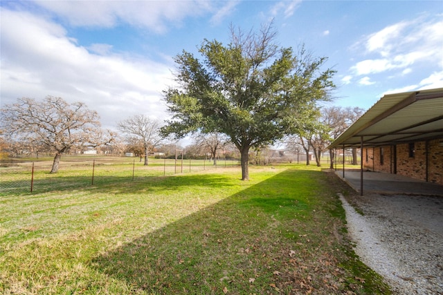 view of yard featuring a patio and a rural view