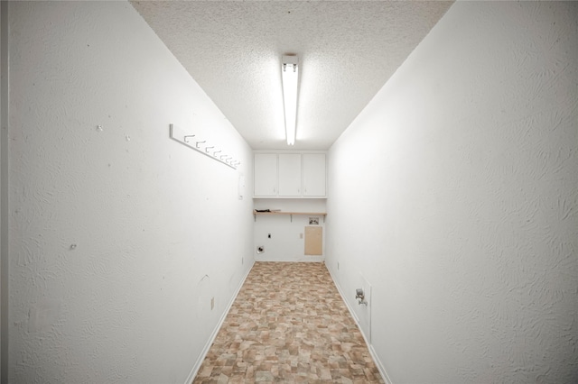 interior space featuring a textured ceiling