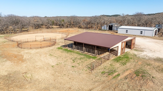 birds eye view of property featuring a rural view